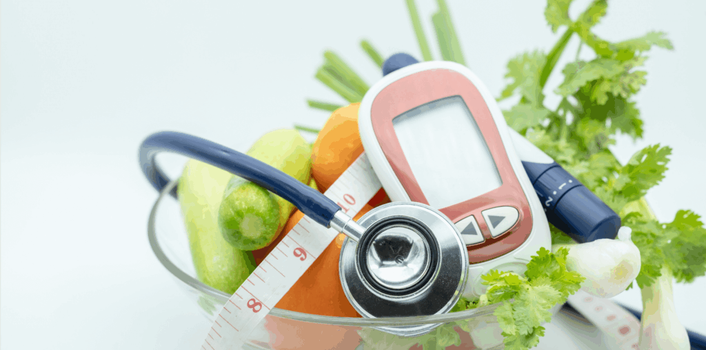 Stethoscope, measuring tape, and bowl of vegetables on a table.