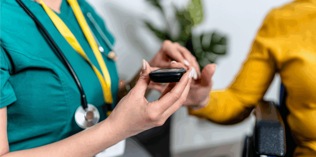 A nurse checks a patient's blood sugar level using a glucose meter.