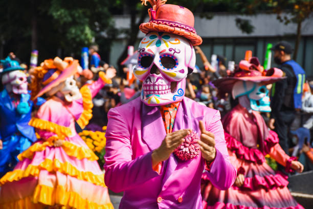 People in disguise during the day of the dead parade