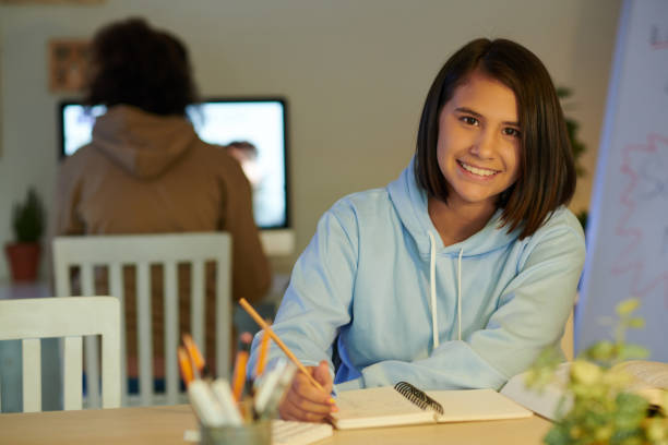 School student creating her schedule in a planner