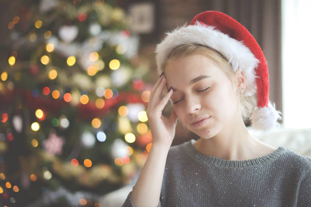 Young woman feeling stressed during christmas season